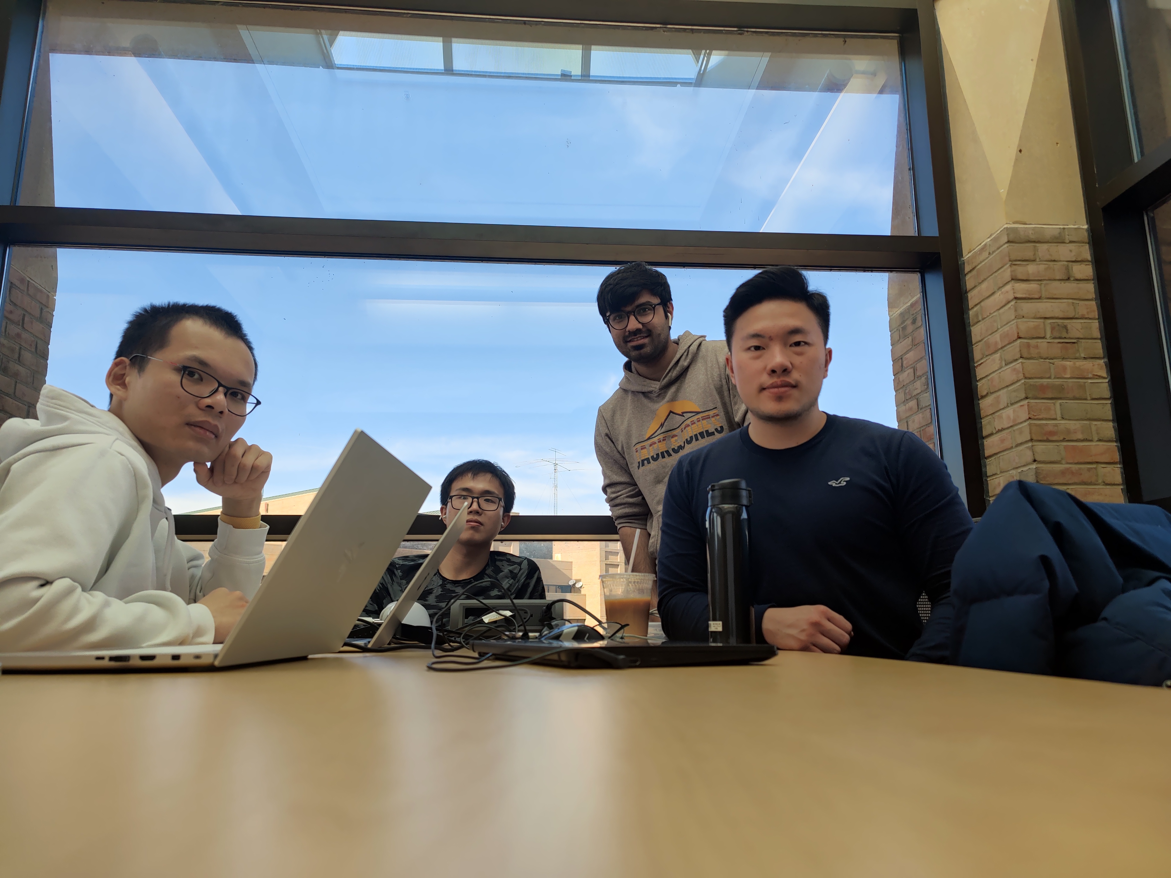 Four people sitting around a table